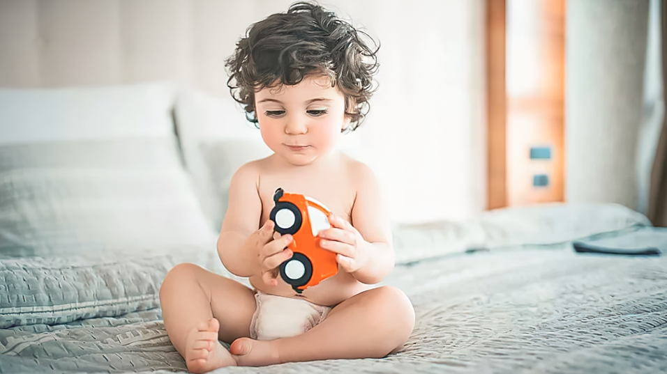Baby playing with toy
